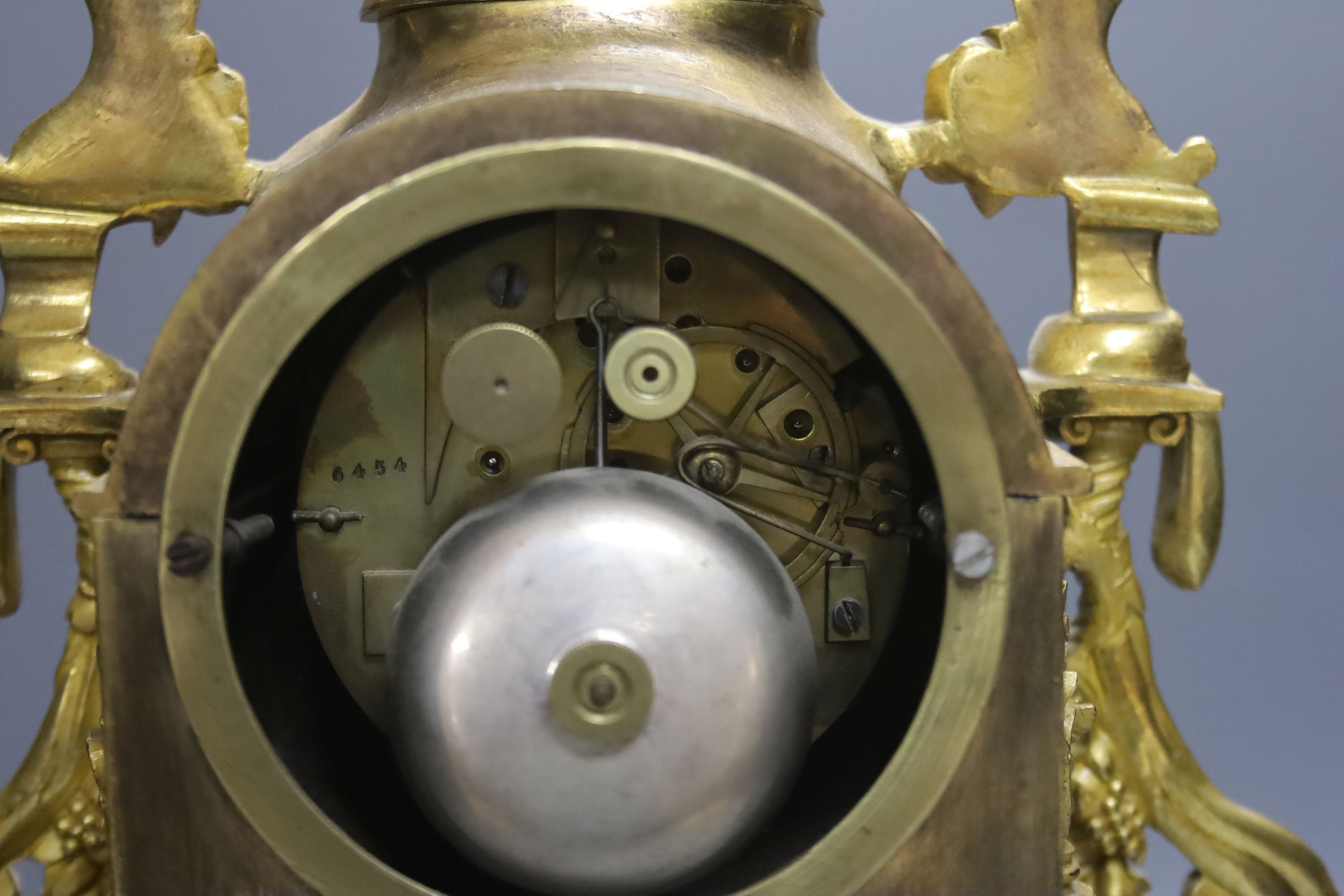 A 19th century French ormolu mantel clock, mounted with an angel, 39cm